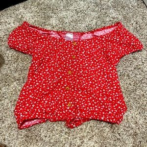 red off the shoulder shirt with white flowers